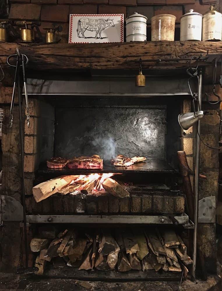 https://www.theyums.com/wp-content/uploads/2018/08/Robert-et-Louise-Steaks-Cooking-in-the-Fireplace-762x1000.jpg